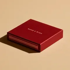 A large red matchbox with the words make a wish