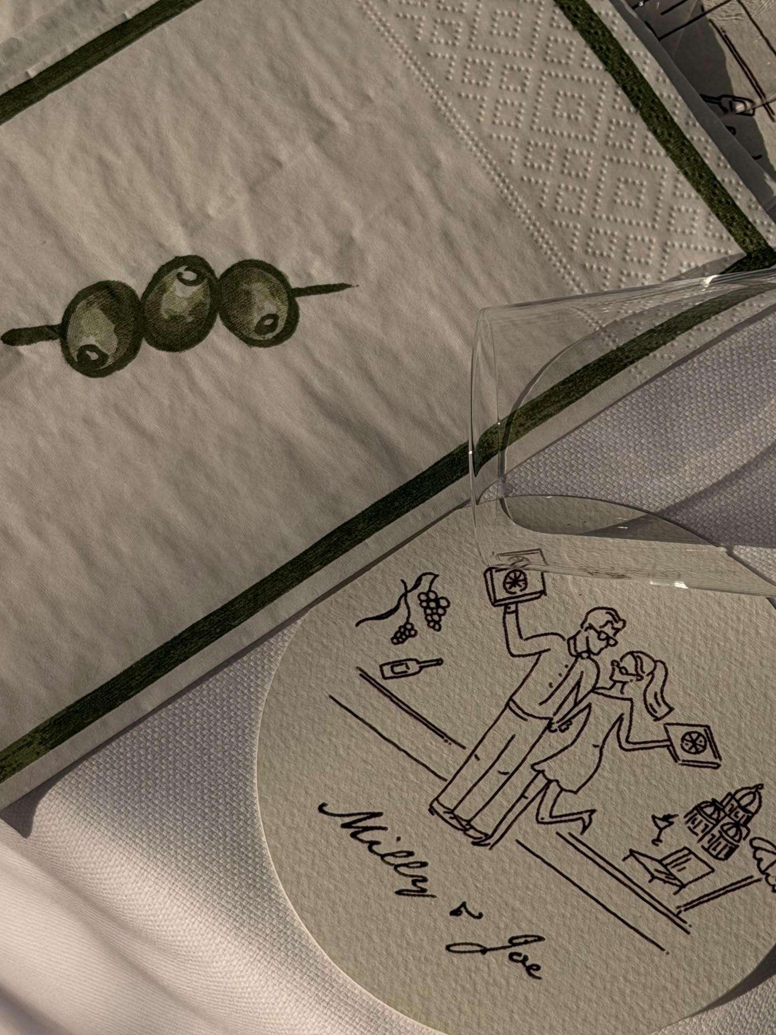 Personalised illustrated coaster with olive green table linen