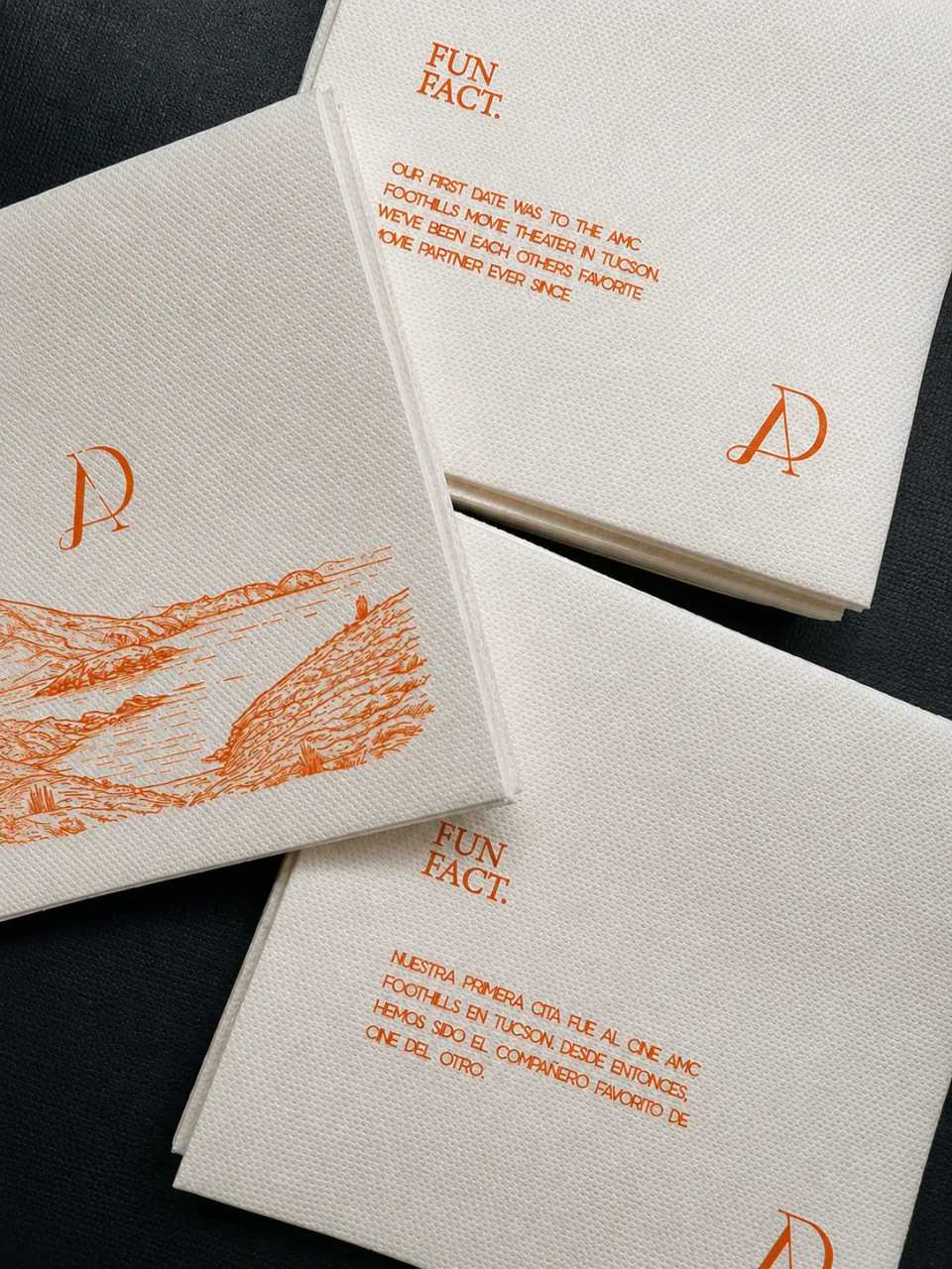 Illustrated napkins with orange line drawings