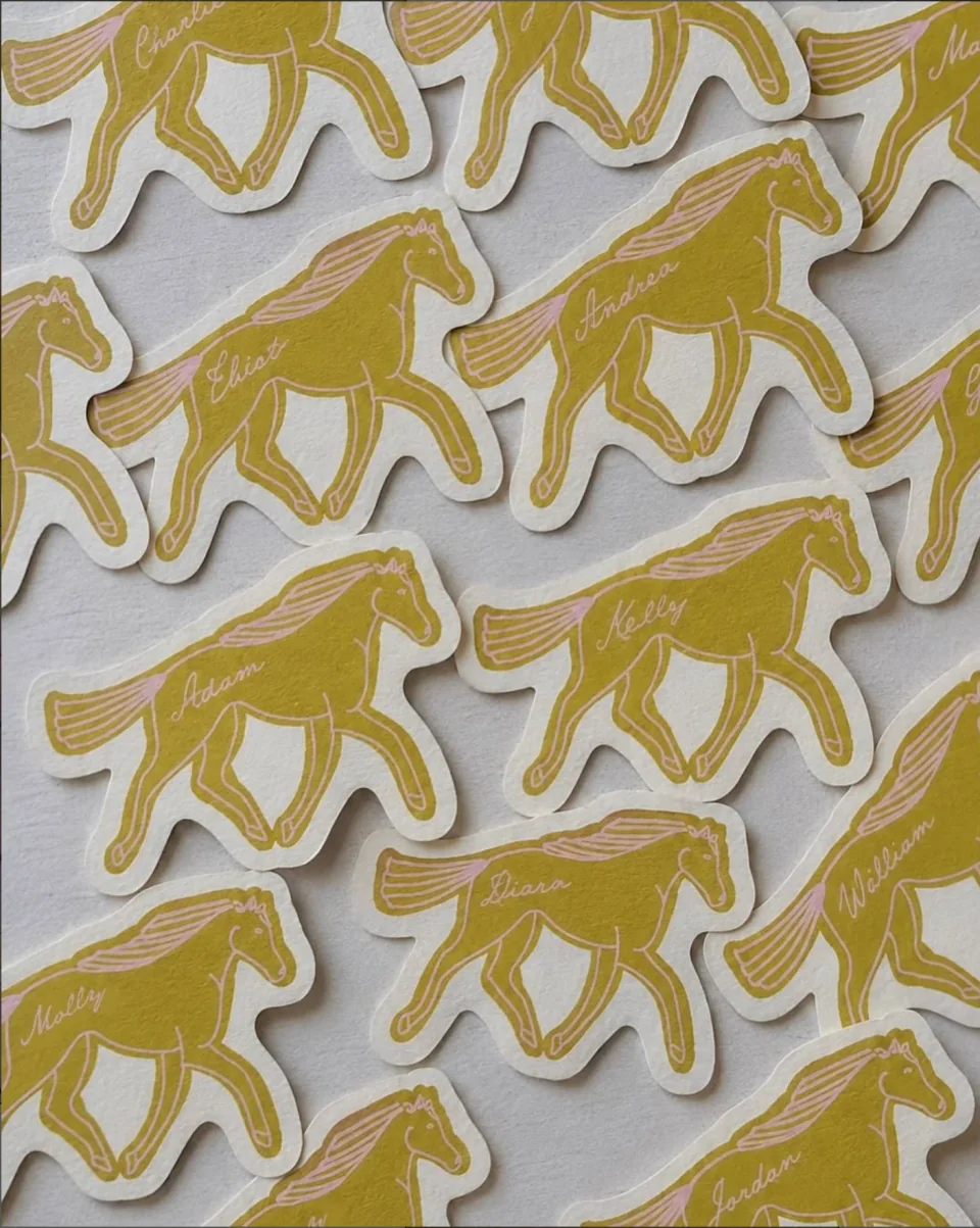 Personalised horse shaped wedding place cards in mustard and blush