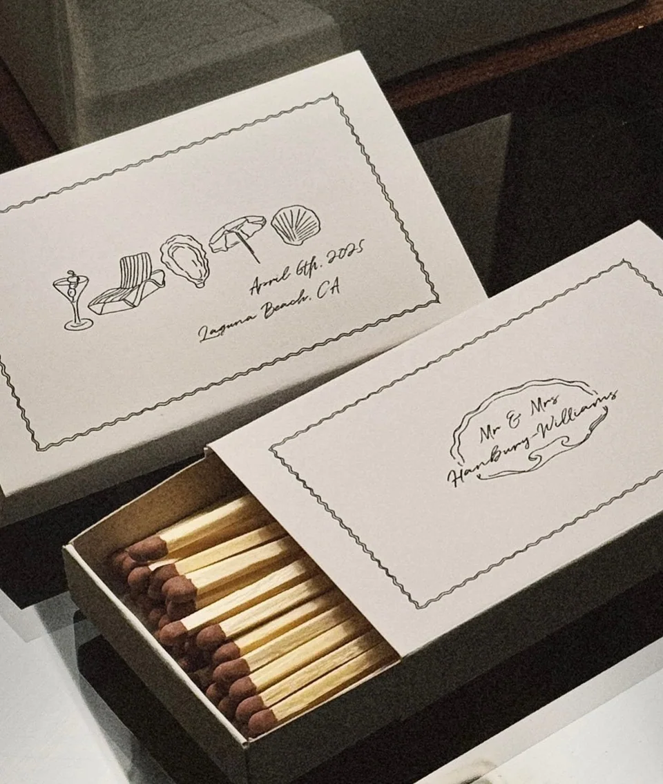 Large wedding matchboxes drawn with a martini, a sun lounger, an oyster and a shell, for Laguna Beach