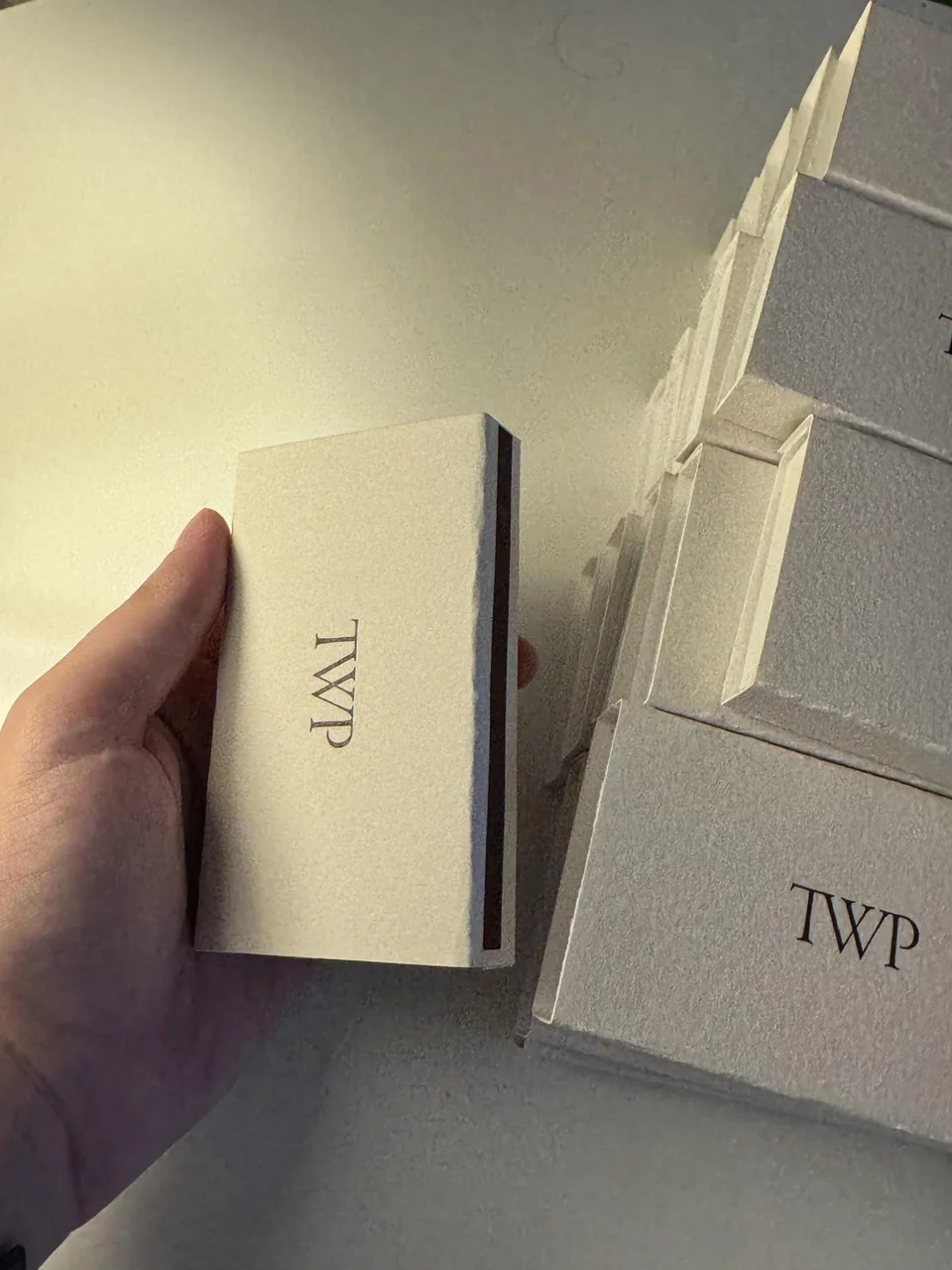 Textured ivory large matchboxes printed with the TWP monogram